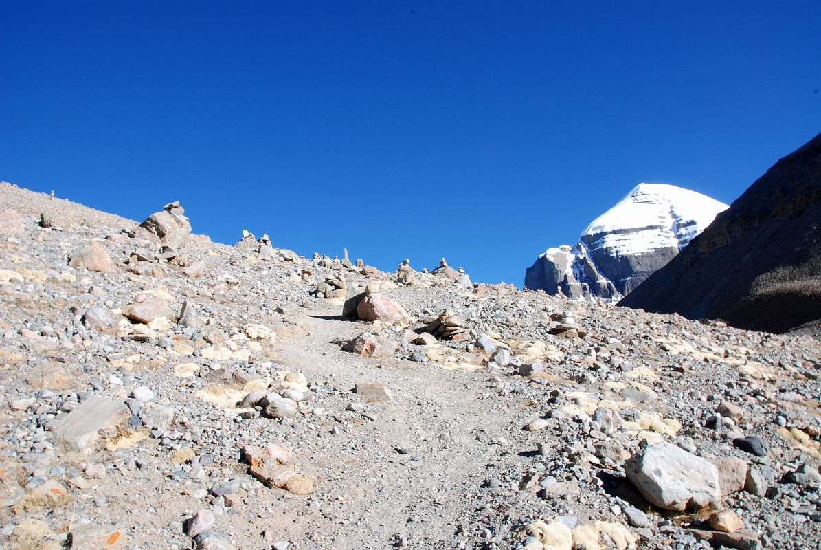 06 Mount Kailash Inner Kora Nandi Parikrama Trail Leading To Ridge With Kailash South Face Still Partially Hidden The trail from the confluence of the two dry rivers leads up to a ridge with the Mount Kailash South Face still partially hidden (08:17).